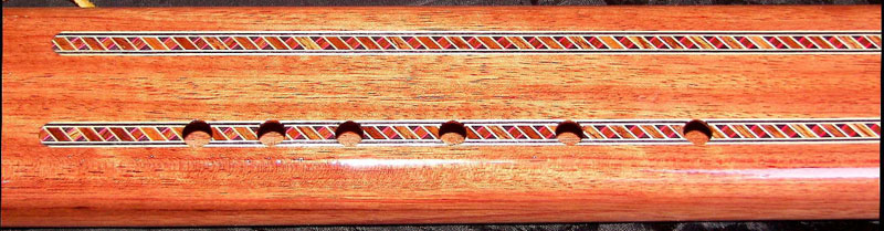 Detail of Rear of Tiger Maple Bubinga Purple Heart Flute by Laughing Crow
